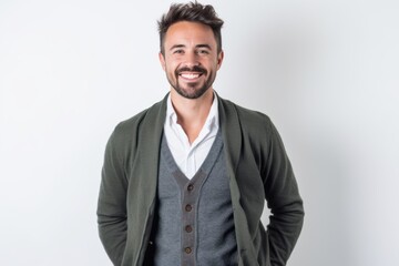 Fototapeta premium Portrait of a handsome young man smiling at camera on white background