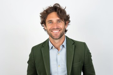 Portrait of handsome man with curly hair smiling at camera against white background