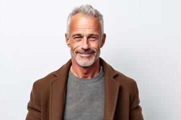 Obraz premium Portrait of a senior man with grey hair smiling at the camera