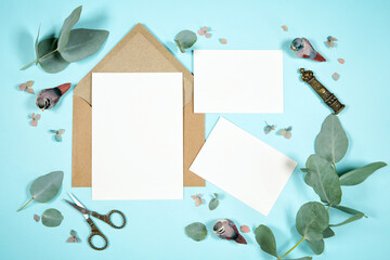 5x7 invitation and two half enclosure cards, wedding stationery suite mock-up styled with blue robin theme decor.