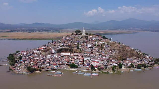 Mexican island named Janitzio at a sunny day. Dron pan over Janitzio Michoacan M&eacute;xico