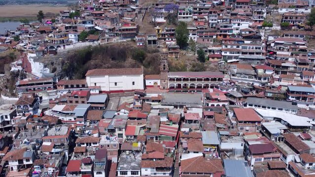 Mexican beautiful and traditional Island named Janitzio during a sunny afternoon. Drone Push out movement