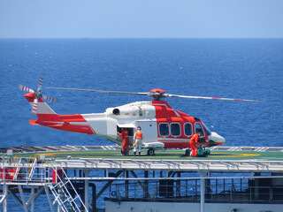 Helicopter transfer passenger at offshore oil and gas
