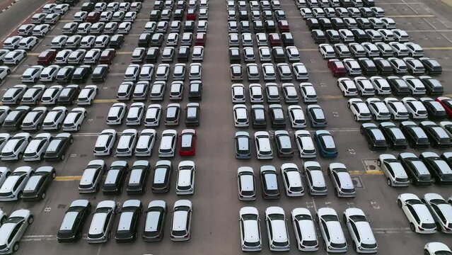 Aerial view of New cars parked in rows ready for delivery