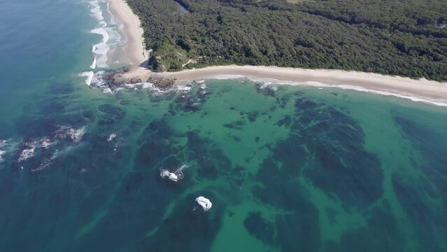 Turquoise Seascape In Wenonah Head Peninsula, Urunga, NSW, Australia - aerial drone shot