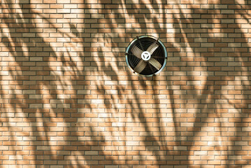 Brick wall with air vent in sunlight with tree shadows in Chengdu, Sichuan province, China - 608885052