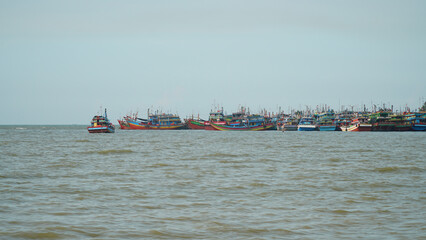 Many traditional fishing boats dock at the harbor on the north coast of Java, Indonesia