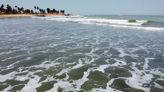 Aerial Drone Fly Low Above Sea Waves of Cape Point Bakau Beach The Gambia, Africa, Travel Destination