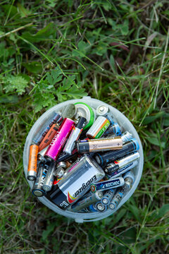 Battery recycle bin with old element on grass. Bishkek, Kyrgyzstan - NOV 20 , 2022: