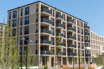 Modern brown apartment buildings in a housing development area in Berlin, Germany