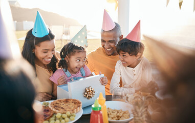 Birthday, party and family outdoors for celebration, bonding and present, happy and excited....