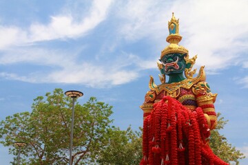 Fototapeta na wymiar Big Giant Or Thai Thao Wessuwan Statue With blue Sky At Thai Temple ,Sattahip Thailand.