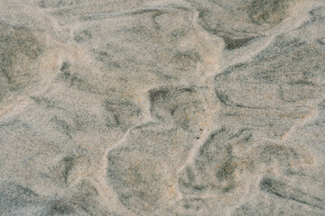 Beach sand pattern at the shallow water area, background material