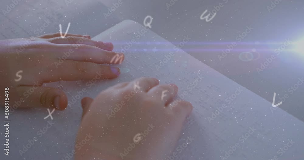 Wall mural Animation of multiple letters and lens flares over cropped hands of blind student reading book