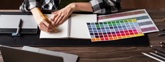 Graphic designer working with sketching logo design at office. Banner design