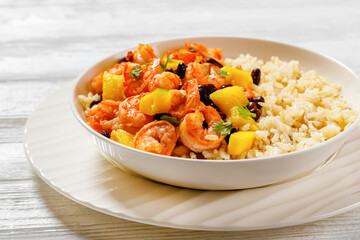 shrimps with beans, mango, brown rice in bowl