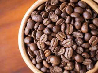 brown arabica coffee bean roast level medium taste delicate lively bright seed caffeine espresso drink food cafe beverage Chiang Rai, Thailand coffee on wooden table background top view selected focus