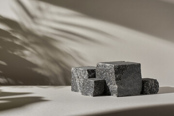 Minimal mockup background with stone podium steps for product presentation. Beige wall with leaf...