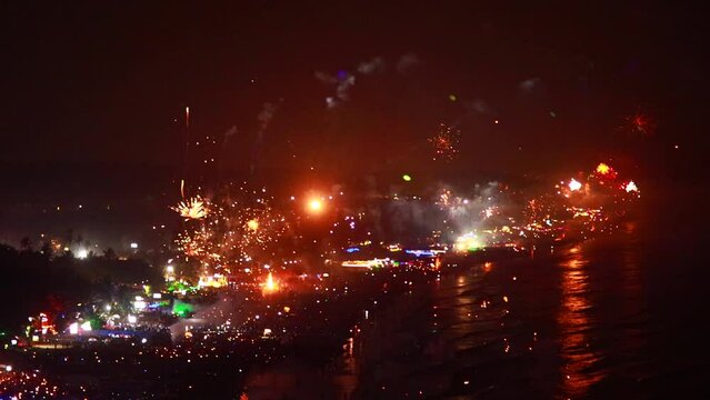 Fireworks on the sea at new year night in Arambol mountain Goa beach India