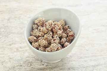 Sweet peanut in sesame seeds
