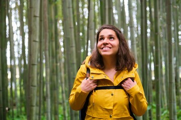 Female european tourist visiting Arashiyama Bamboo Forest in Kyoto, Japan.