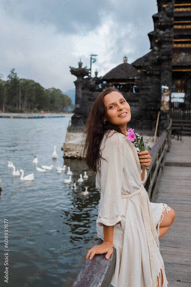 Wall mural portrait of a young european girl, brunette, with brown eyes, travels to the sights of bali, posing 