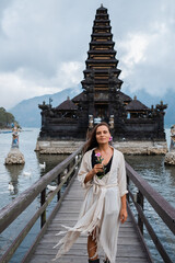- [x] Portrait of a young European girl, brunette, with brown eyes, travels to the sights of Bali,...