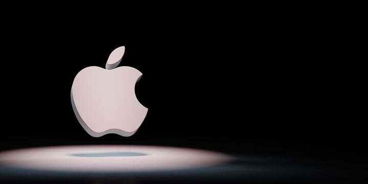 Apple Inc. Logo Spotlighted on Black Background