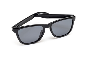 Black modern sunglasses on a white background
