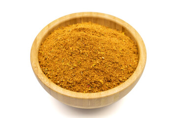 Cajun spice powder isolated on white background. Powdered dried cajun in wooden bowl