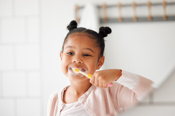 Toothbrush, brushing teeth and child in a home bathroom for dental health and wellness. Face of...