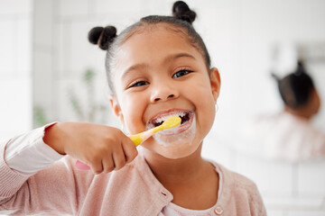 Toothbrush, brushing teeth and face of a child in a home bathroom for dental health and wellness....