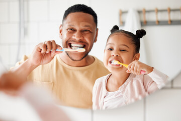 Child, dad and brushing teeth in a family home bathroom for dental health and wellness in a mirror. Face of african man and girl kid learning to clean mouth with toothbrush and smile for oral hygiene