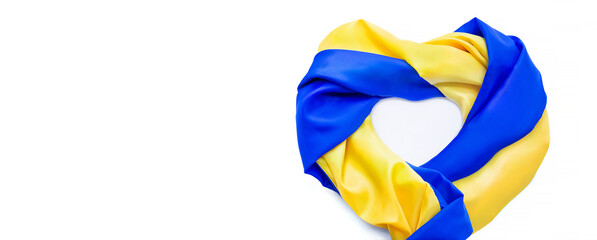 Banner of national flag of Ukraine in form of heart. Fabric curved flag in yellow-blue colors in...