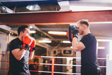 Fototapeta na wymiar Boxers do boxing training on a gym