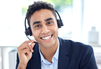 Portrait, call center and business man smile in office for support, customer service or telemarketing. Face, contact us and sales agent, crm consultant and person from Brazil consulting at help desk.