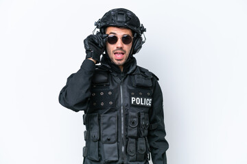 Young caucasian SWAT man isolated on white background with glasses and surprised