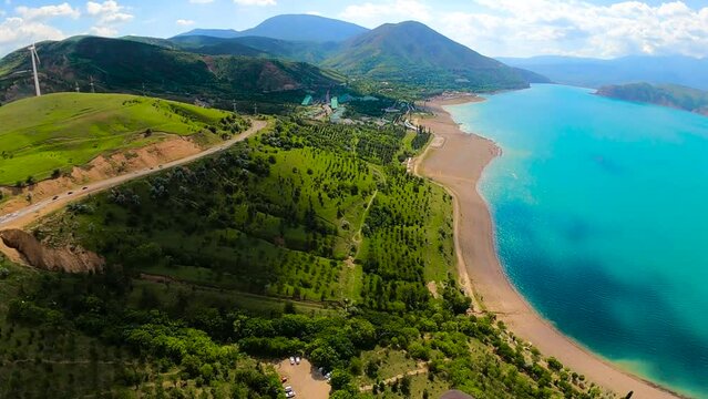paragliding point of view in Uzbekistan. paraglider flying over the Amirsoy ski slope and Charvak lake. Extreme and active types of recreation. panoramic view from gopro. High quality FullHD footage