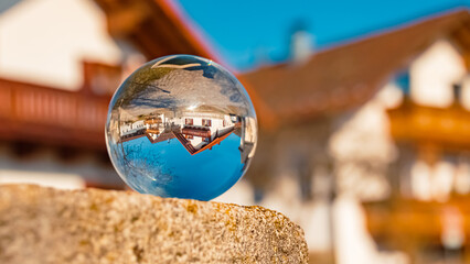 Crystal ball landscape shot with buildings at Herrnfehlburg, Rattiszell, Bavarian forest, Straubing-Bogen, Bavaria, Germany