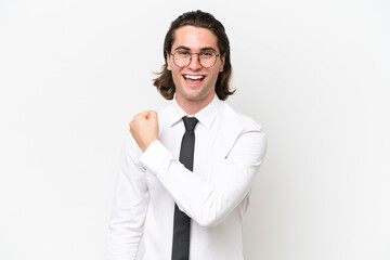 Business handsome man isolated on white background celebrating a victory