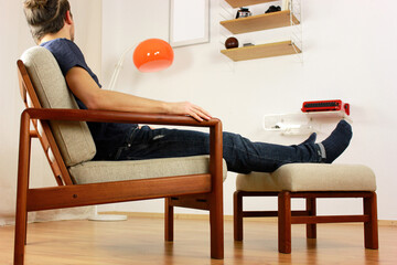 Armchair with Ottoman Danish Design in a Cosy Modern Furnished Living Room 60s Style Interior with...