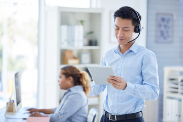 Call center, tablet and search with asian man in office for consulting, customer service and...