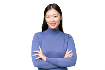 Young Asian woman over isolated chroma key background keeping the arms crossed in frontal position