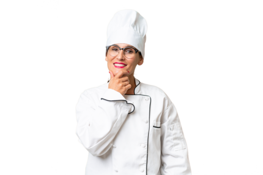 Middle-aged chef woman over isolated background with glasses and smiling