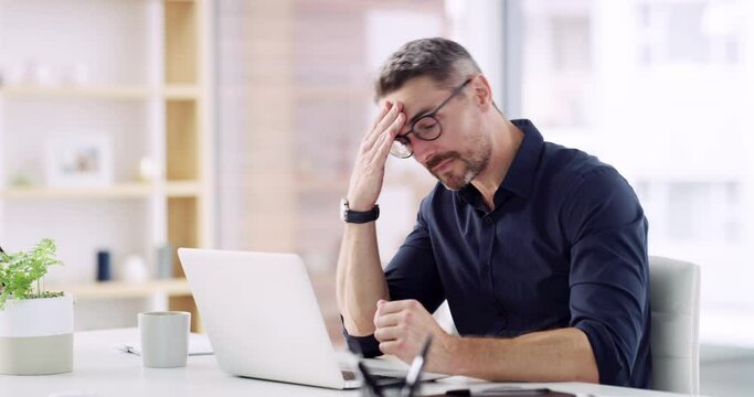 Business man, stress and headache at laptop for eye strain, mental health problem and crisis of brain fog. Tired, burnout and frustrated worker at computer with fatigue, pain and anxiety in office