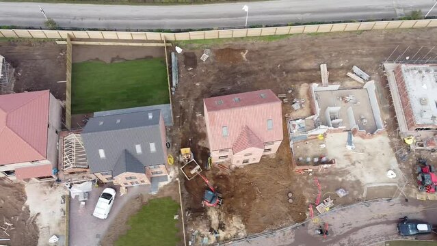 Top down sideways view of quality new houses being built on a new housing estate.