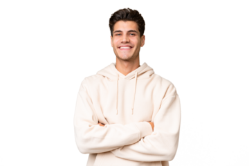 Young caucasian handsome man over isolated background with arms crossed and looking forward
