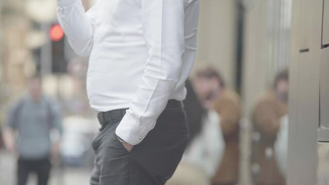 Businessman taking a break to smoke an e-cigarette during the day