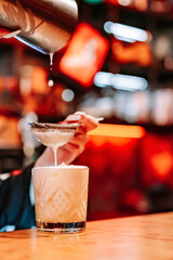 woman hand bartender making cocktail on the bar counter
