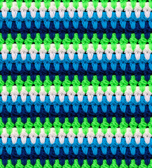 Seamless knitted texture in afghan style. The pattern is crocheted from multi-colored acrylic yarn....